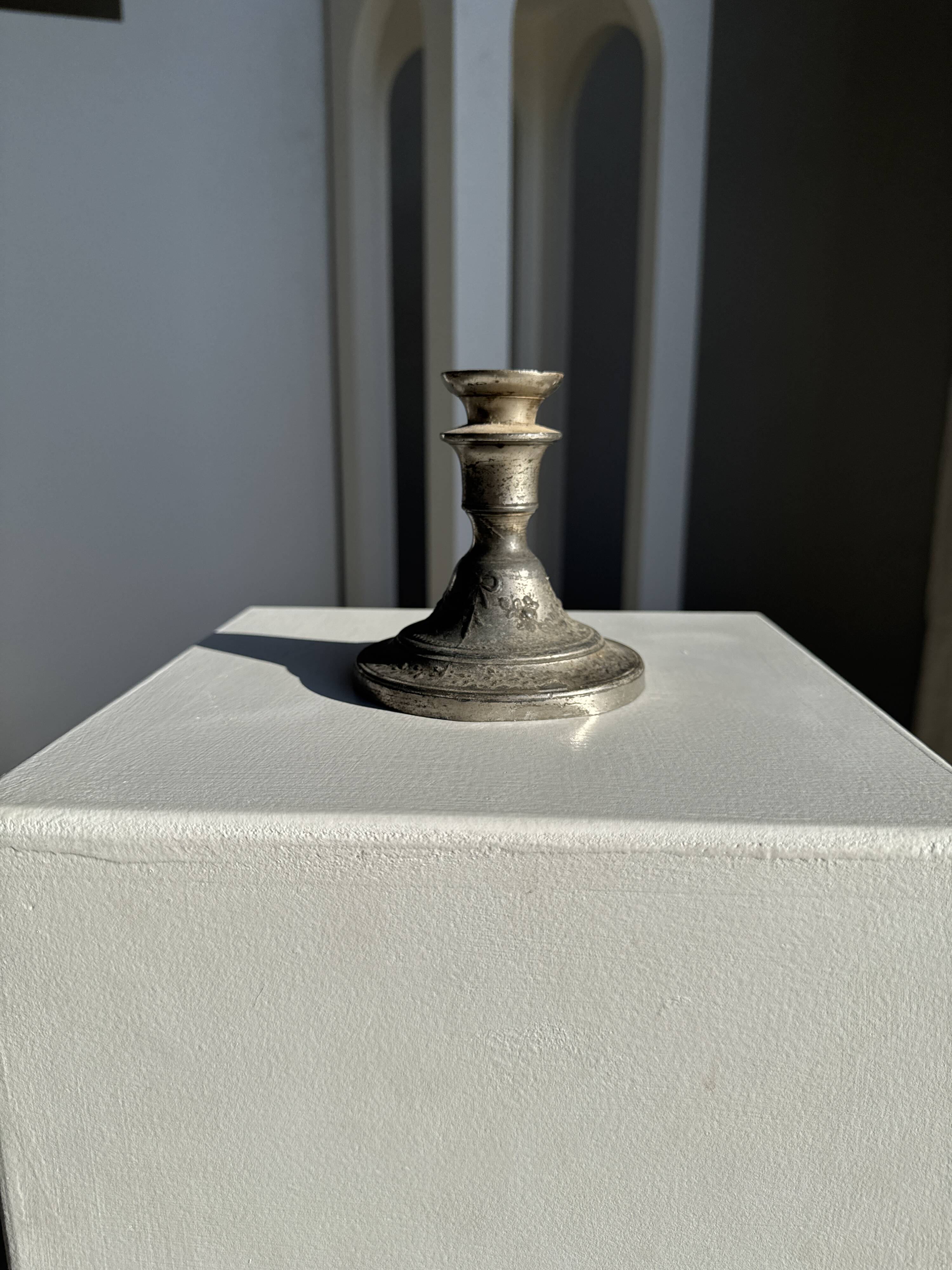Small antique candle holder engraved in silver-plated metal, in its original condition.
