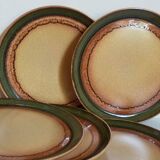 Six vintage stoneware plates with green net