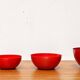 Modern mid-century red enamel bowl sets by Kaj Franck for Finel, Finland, 1960s, set of 4.