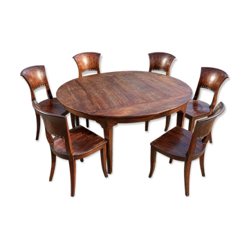 Round teak table with 6 Indonesian chairs.