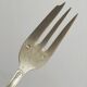 Paire de fourchettes en métal argenté, design orné