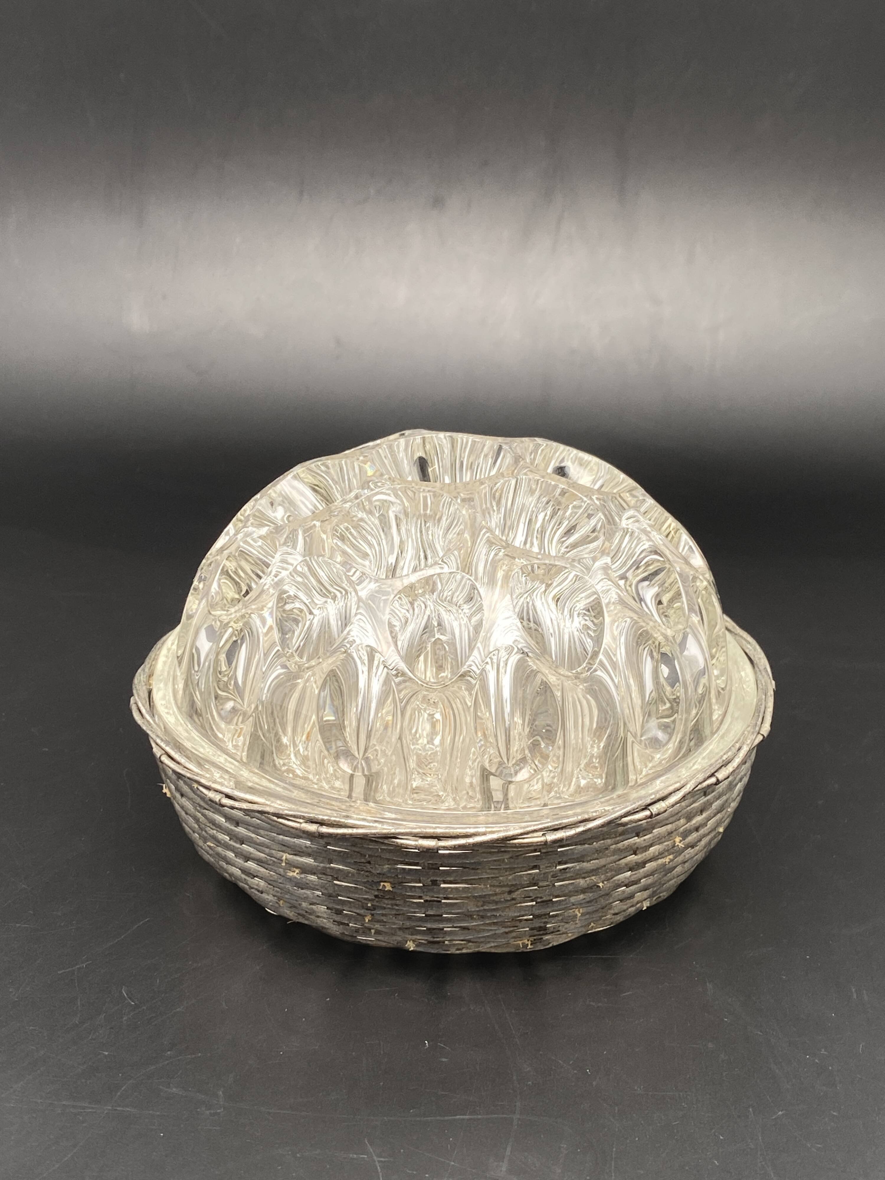 Glass flower stand with woven metal support