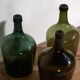 Antique green demijohns (circa 1920). Set of 3 pieces