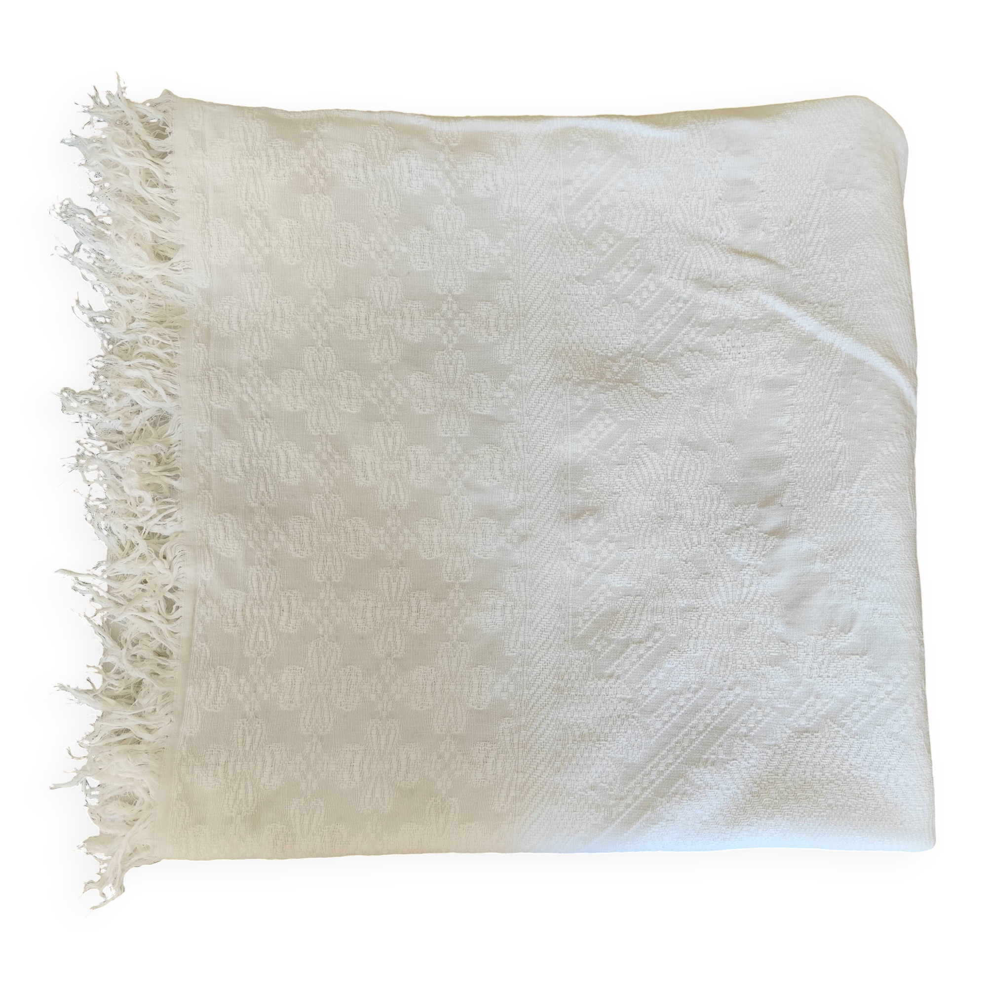White woven cotton bedspread with fringes