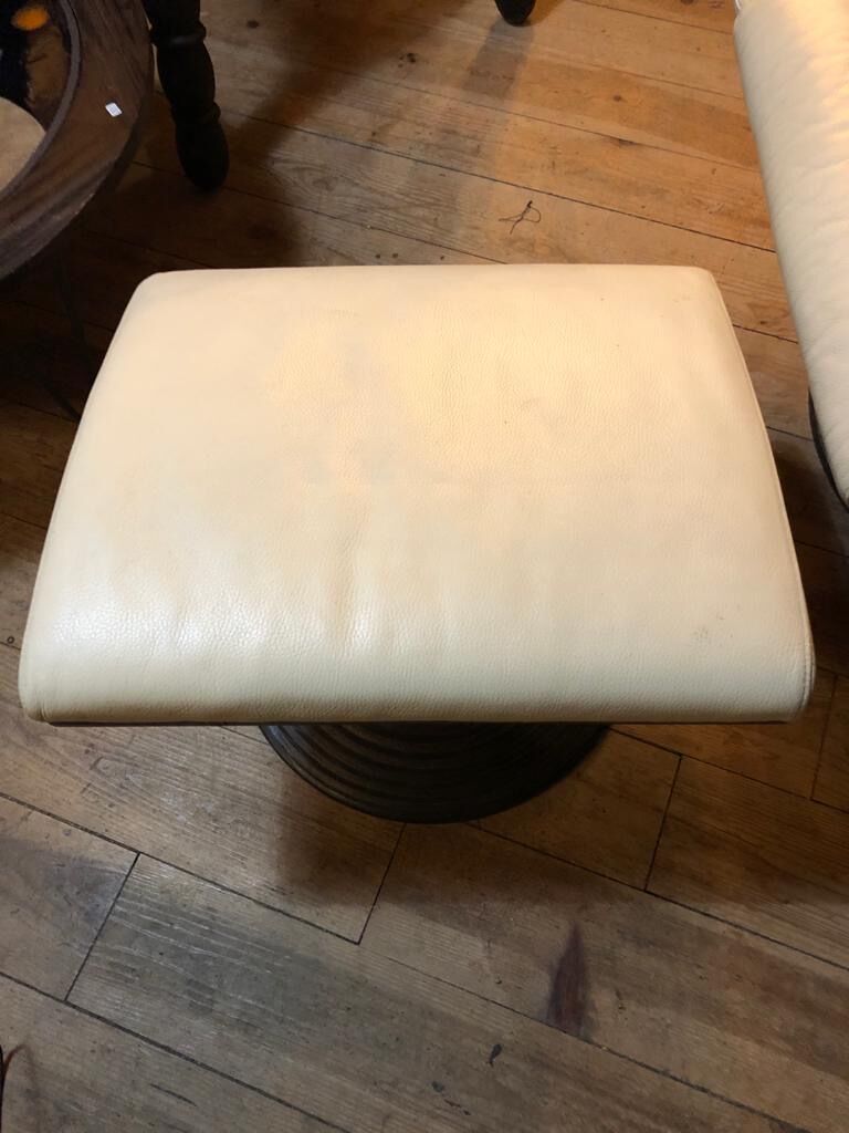 White leather armchair and ottoman