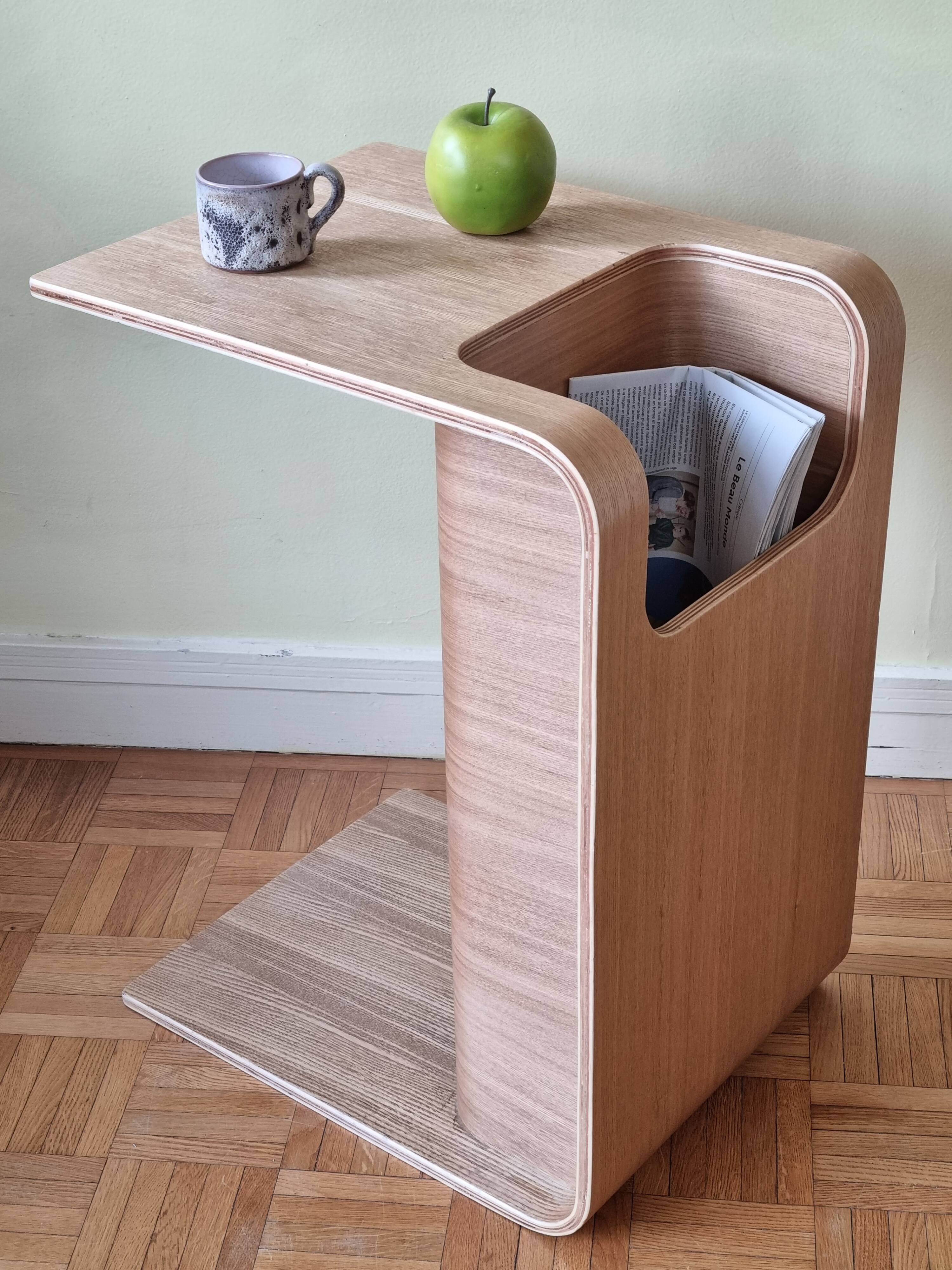 Boone coffee table in curved wood produced by Habitat, design