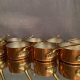 Suite of 12 tinned copper pans