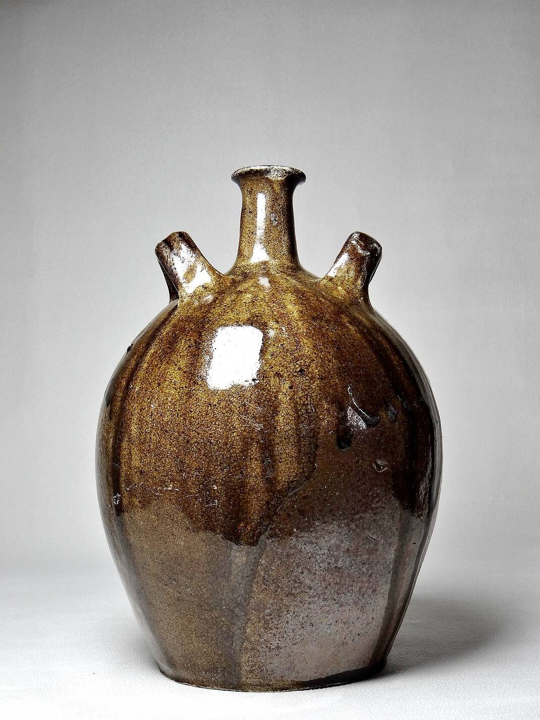 Old stoneware oil jar, glazed and enamelled, 2 handles