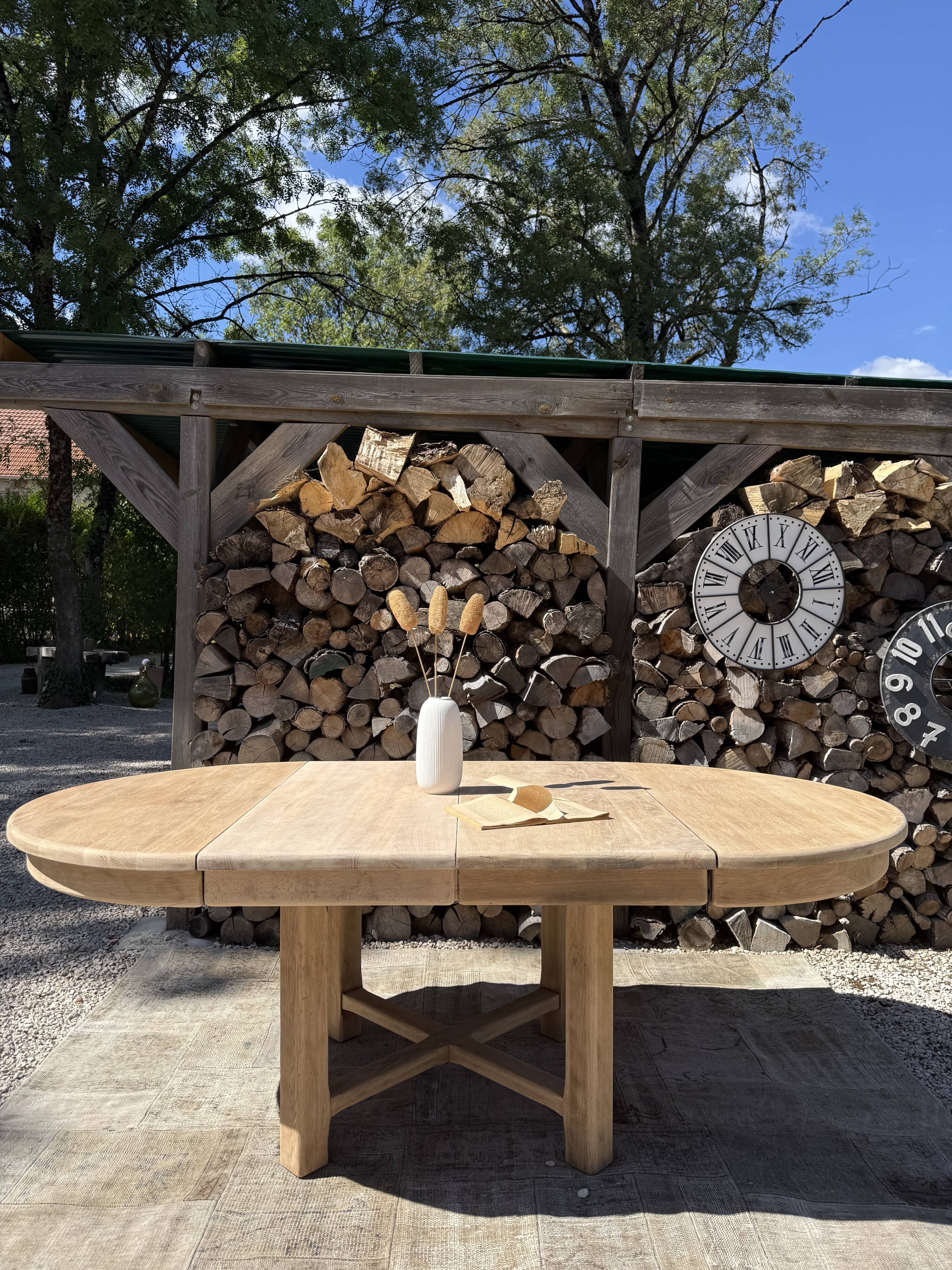 Round solid oak table with extensions, maximum 220cm.