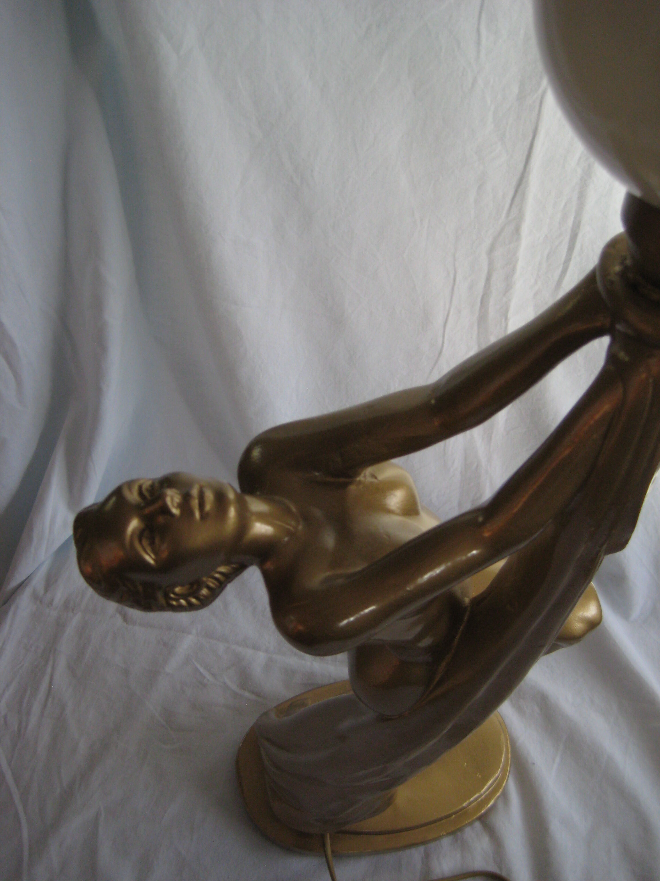 Lamp depicting a with a drape