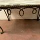 Table basse en fer forgé martelé plateau en marbre brèche xx siècle