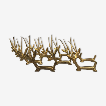 Series of twelve knife holders in gilded bronze, gazelle shape