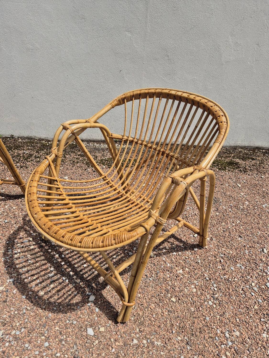 Rattan lounge with two armchairs and a vintage 1950s bench.