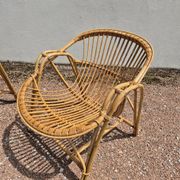 Rattan lounge with two armchairs and a vintage 1950s bench.