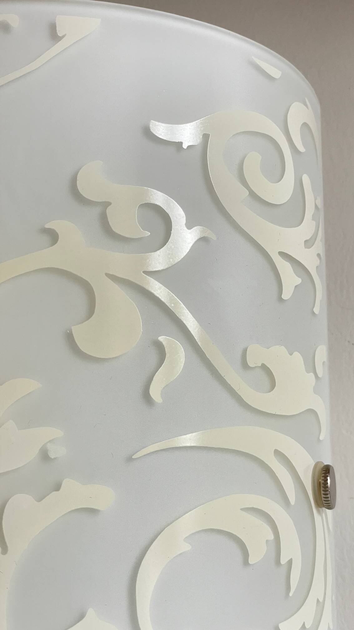 Polished and screen-printed glass sconce by eglo