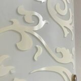 Polished and screen-printed glass sconce by eglo