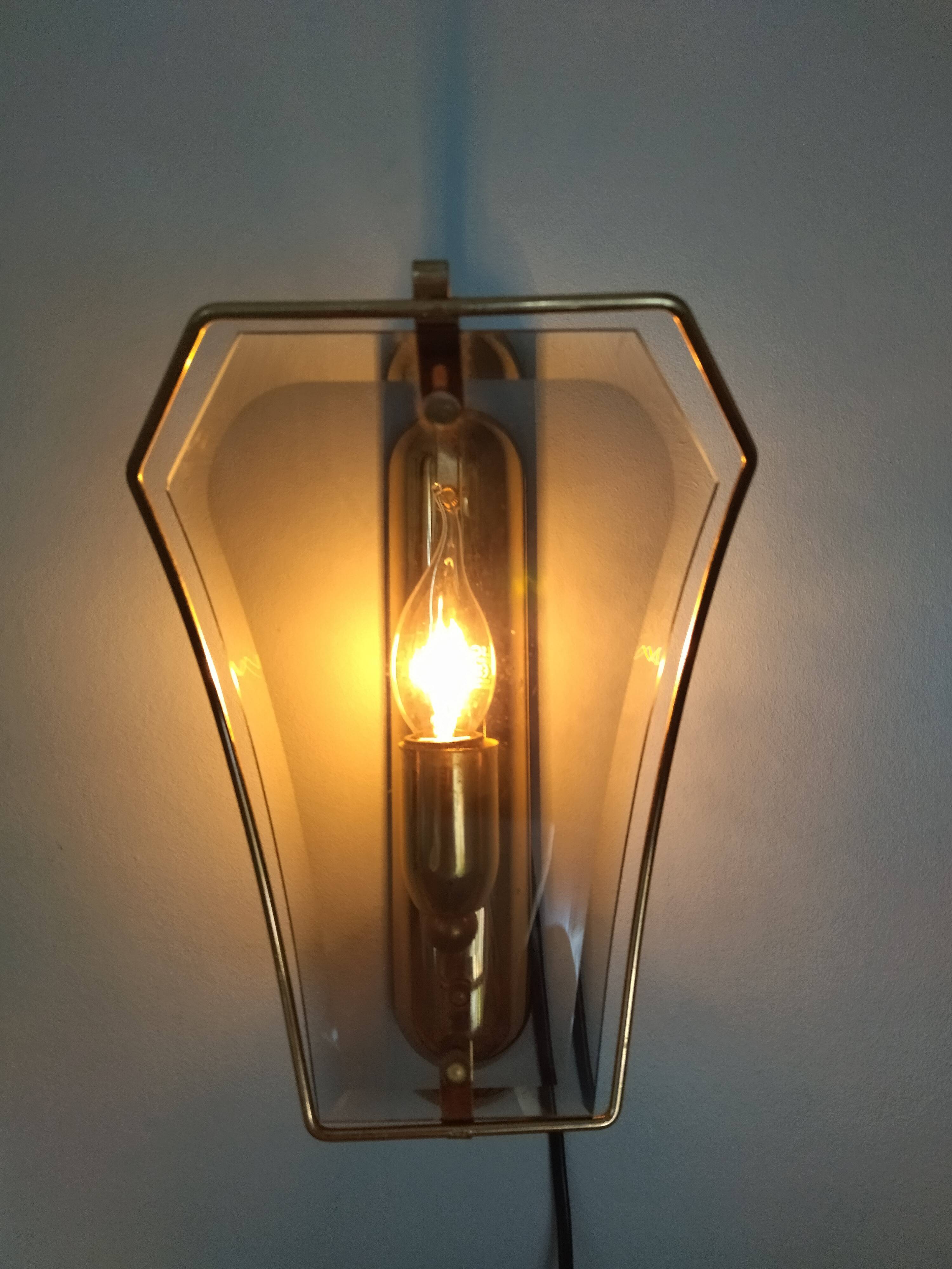 Pair of brass and curved glass wall lamps from the 80s