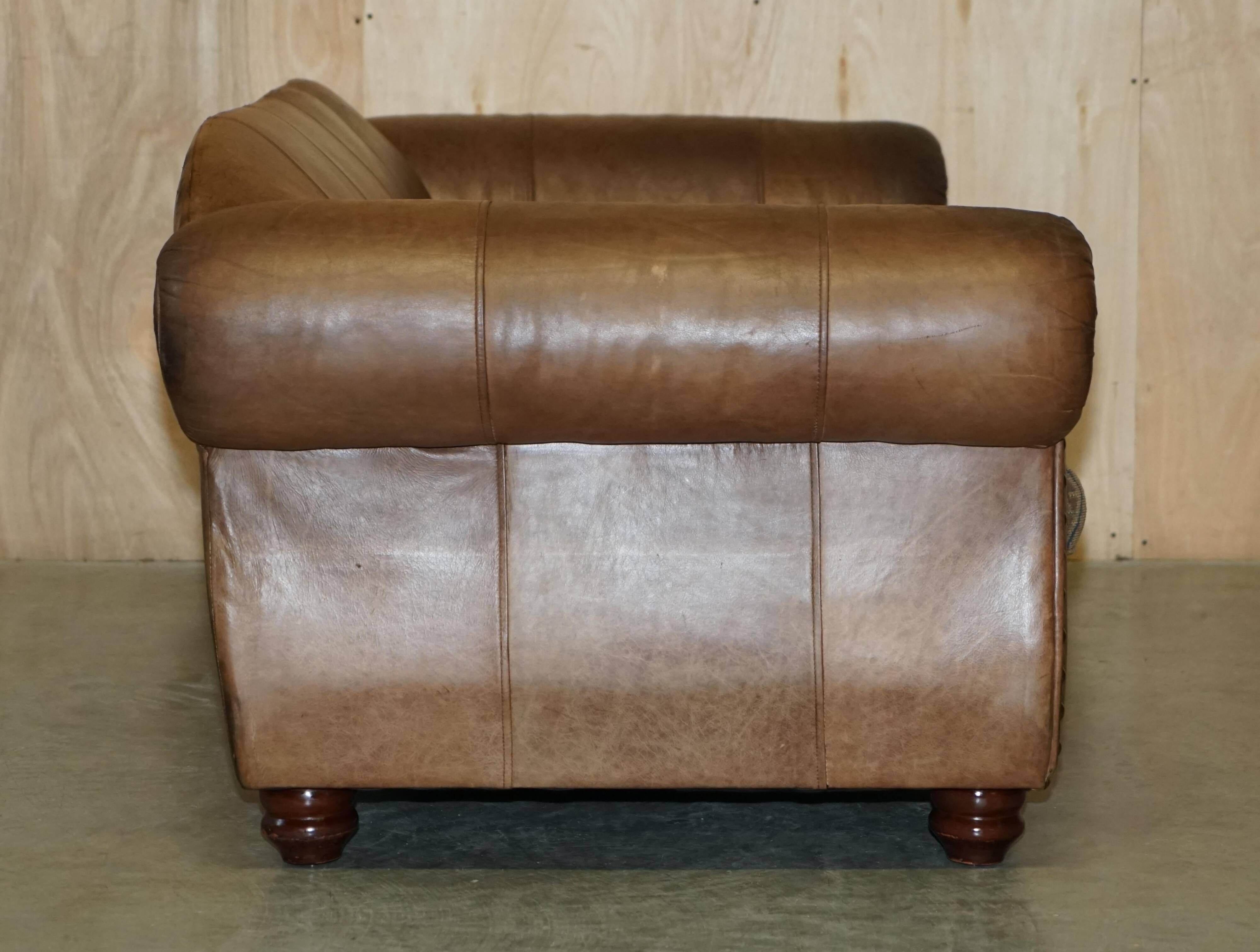 Vintage leather sofas by Thomas Lloyd with Kilim cushions.