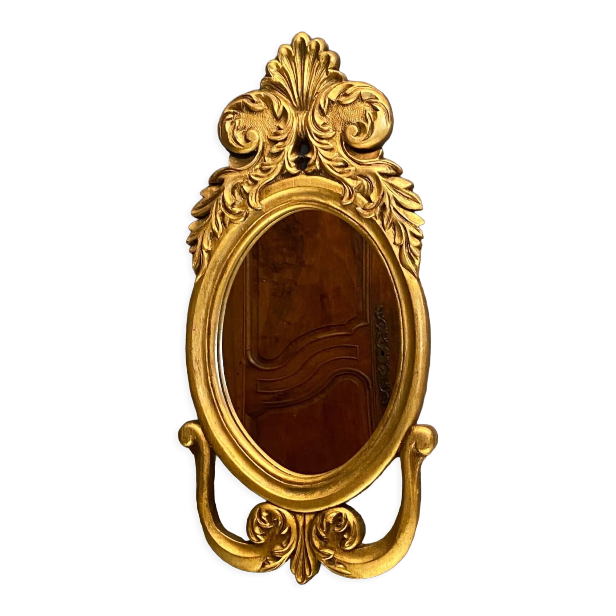 Oval view mirror in gilded wood with leafy decoration in Regency style
