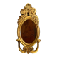 Oval view mirror in gilded wood with leafy decoration in Regency style