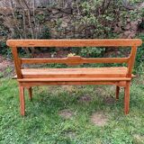 Old wooden bench with backrest, dated 1923