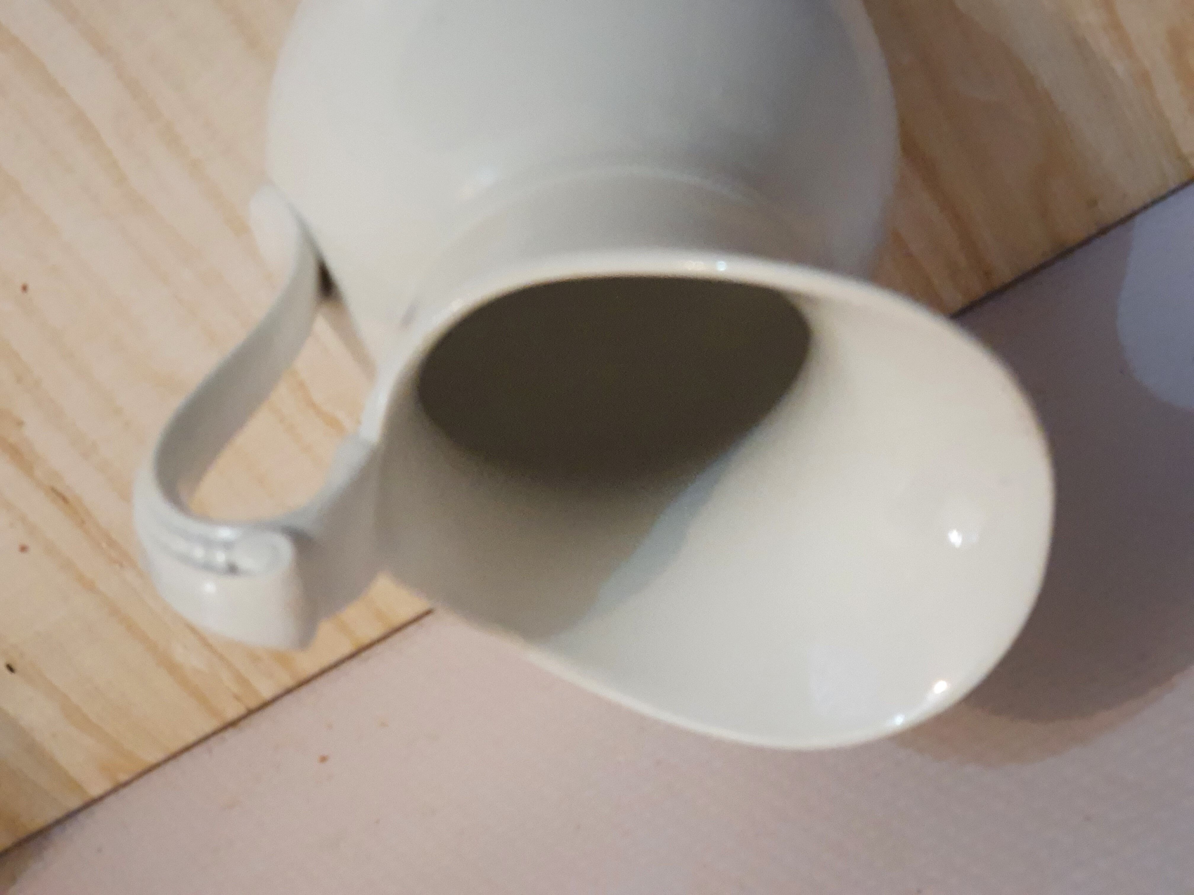 Antique pitcher pitcher in white porcelain