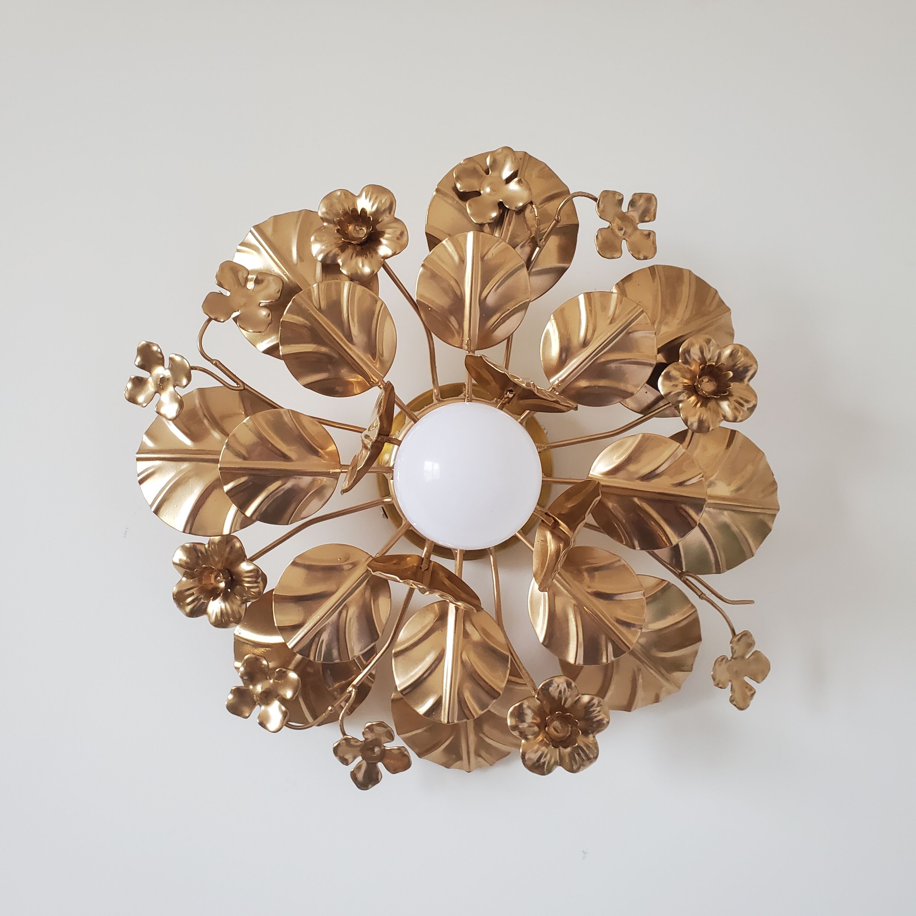 Golden metal flower sconces