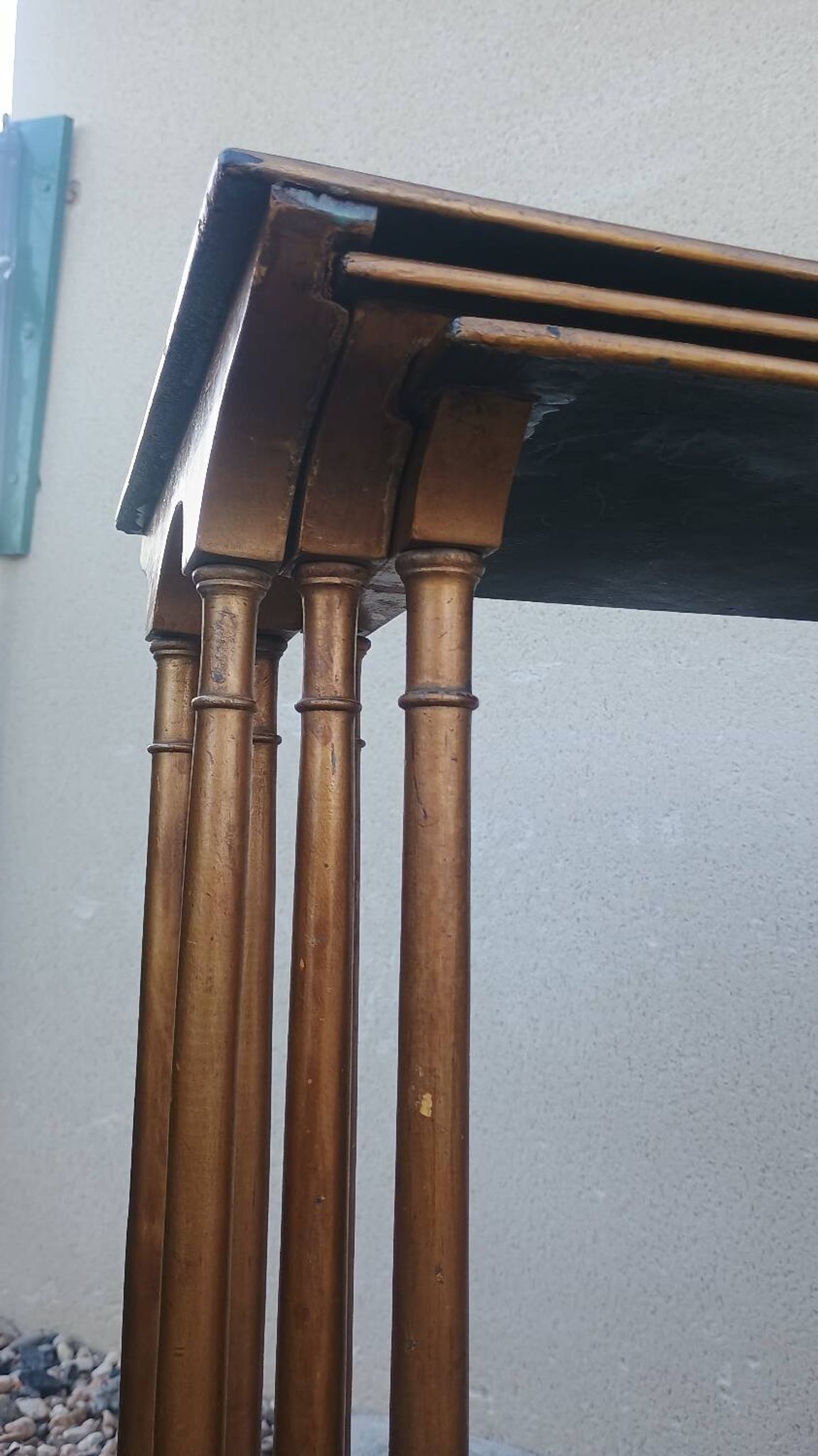 Sets of three nesting tables with painted landscape decorations in poplar.