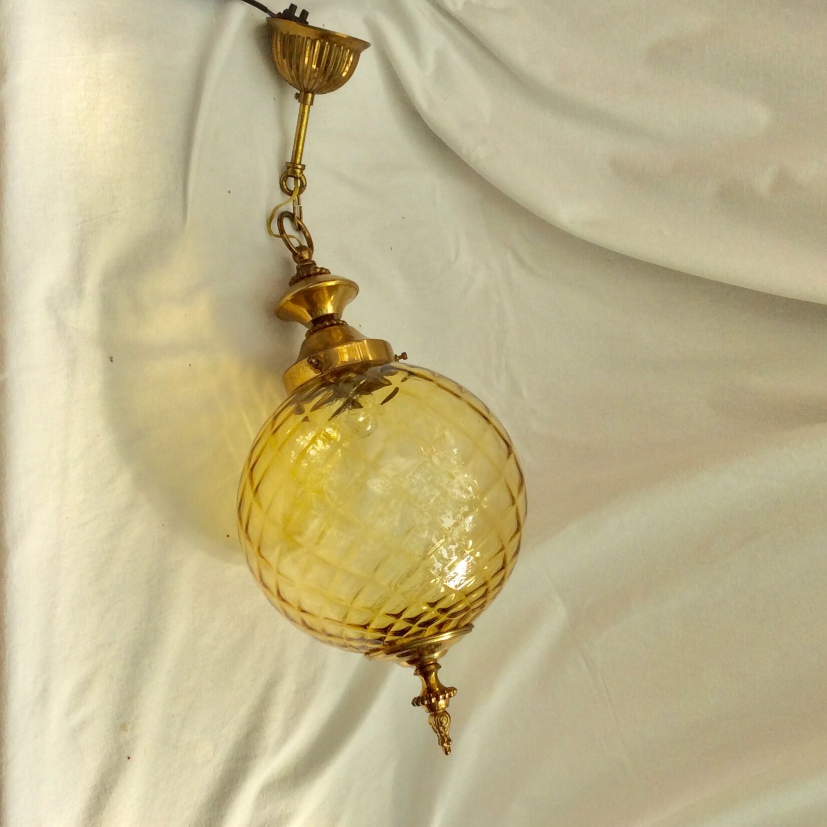 Amber glass suspension with brass