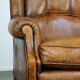 Sheepskin wingback chair with a unique design and a beautiful patina