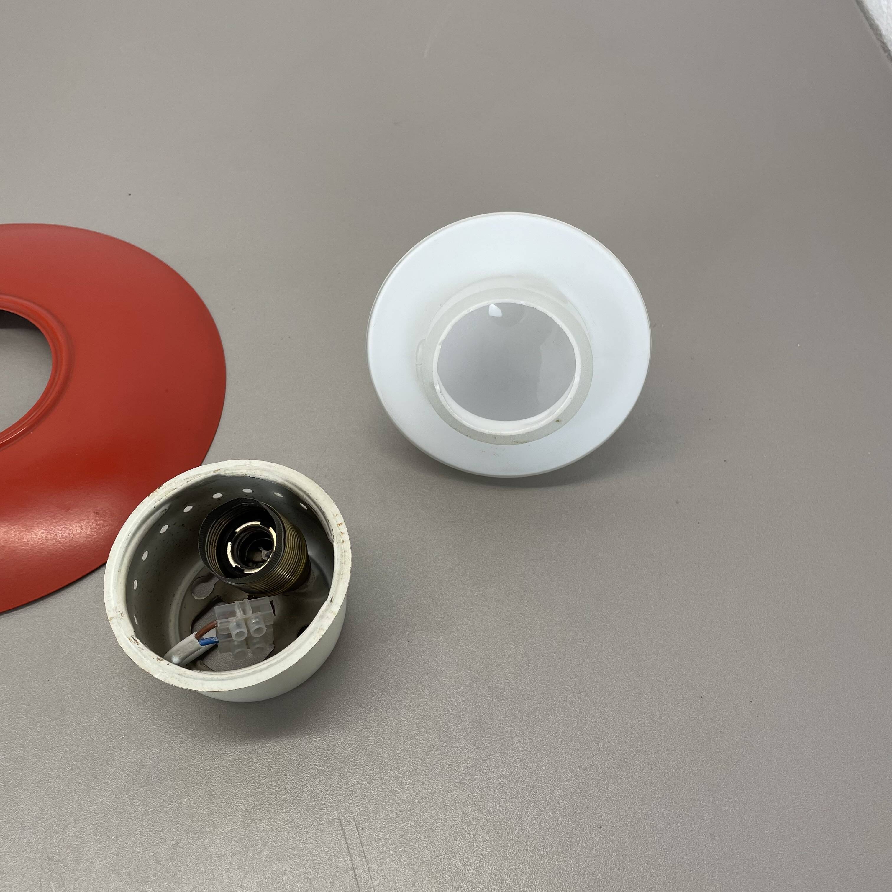 Round red wall light in metal and opaline glass in the Stilnovo style, 20 cm, Italy, 1960s