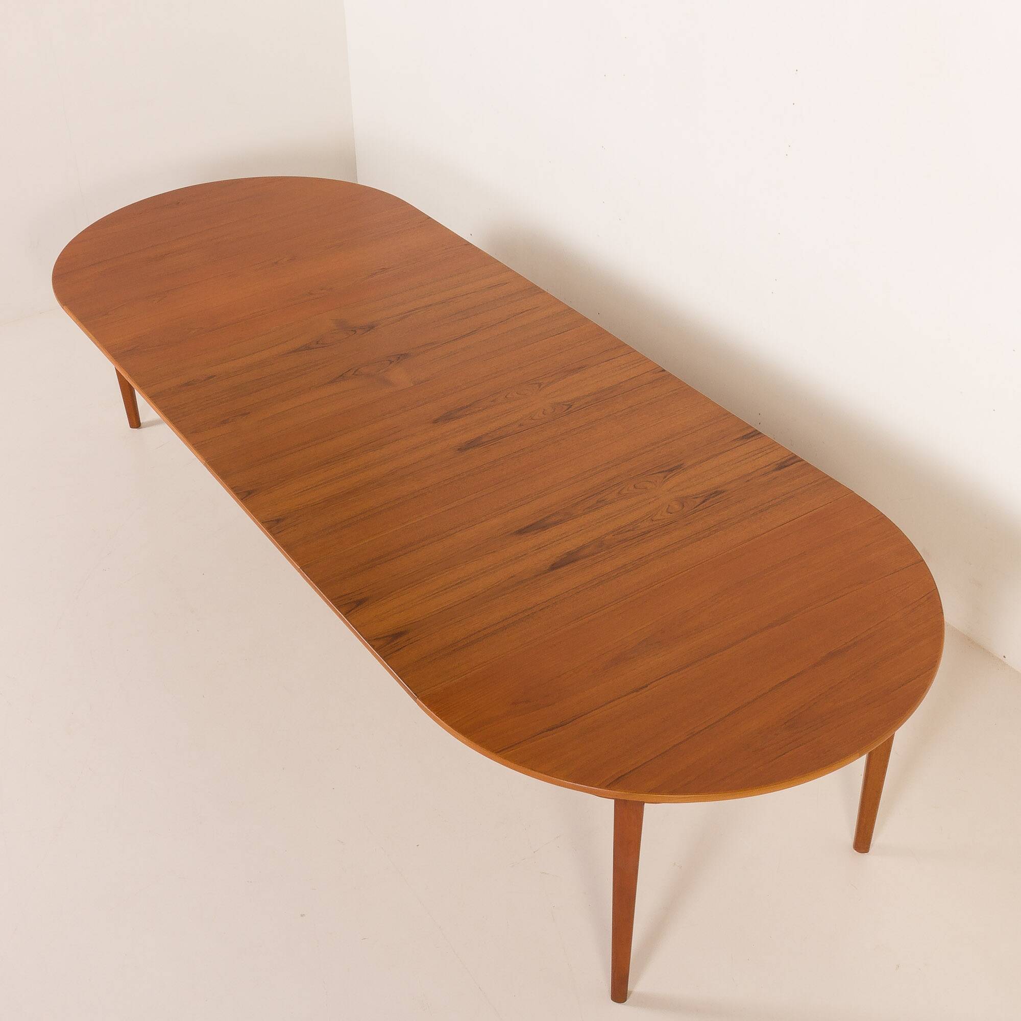 Henning Kjaernulf attributed extra large teak table with 4 inner leaves for Soro, Denmark 1960s