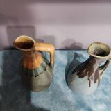 Two enameled stoneware pitchers