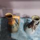 Two enameled stoneware pitchers