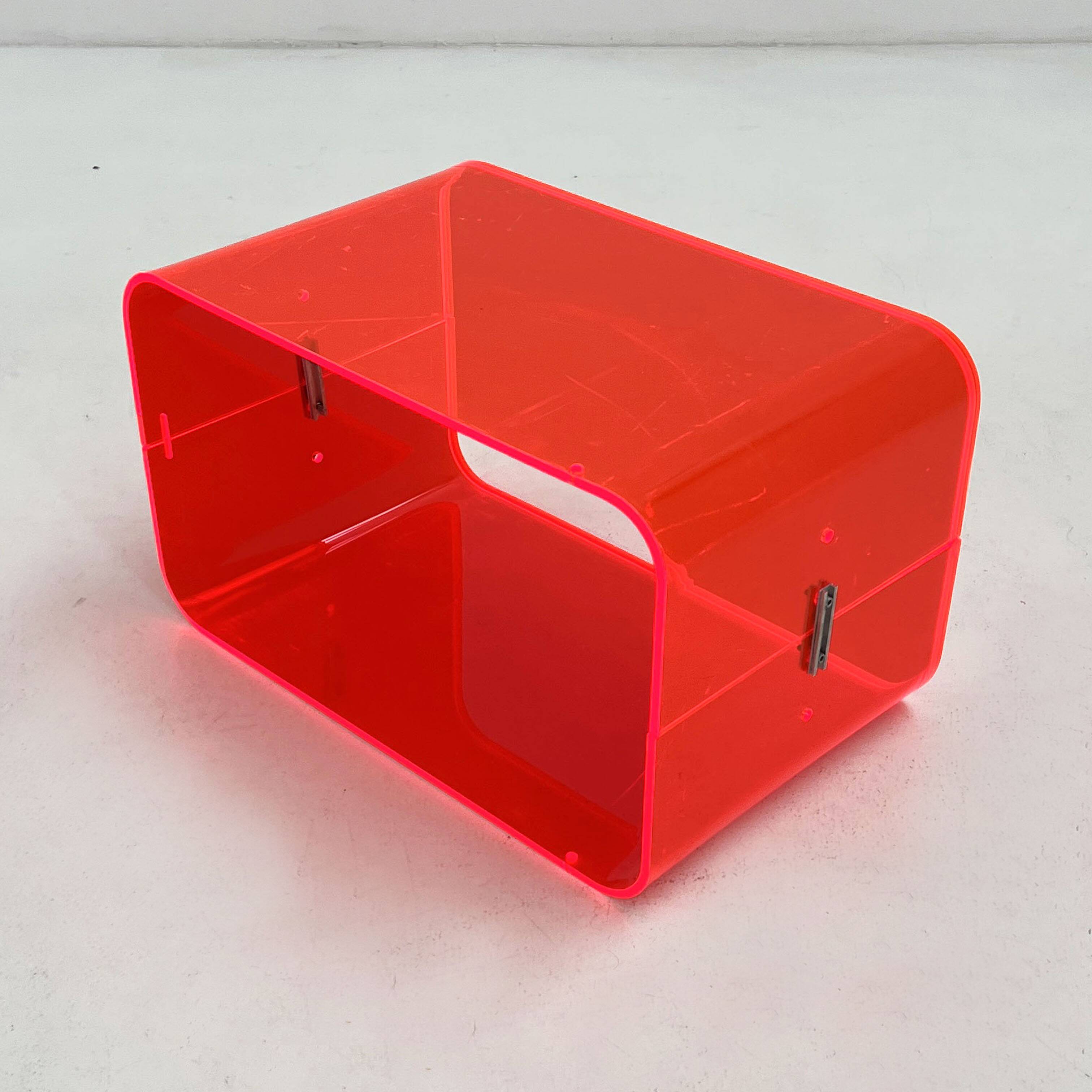 Fluorescent pink plexiglass coffee table, 1980.