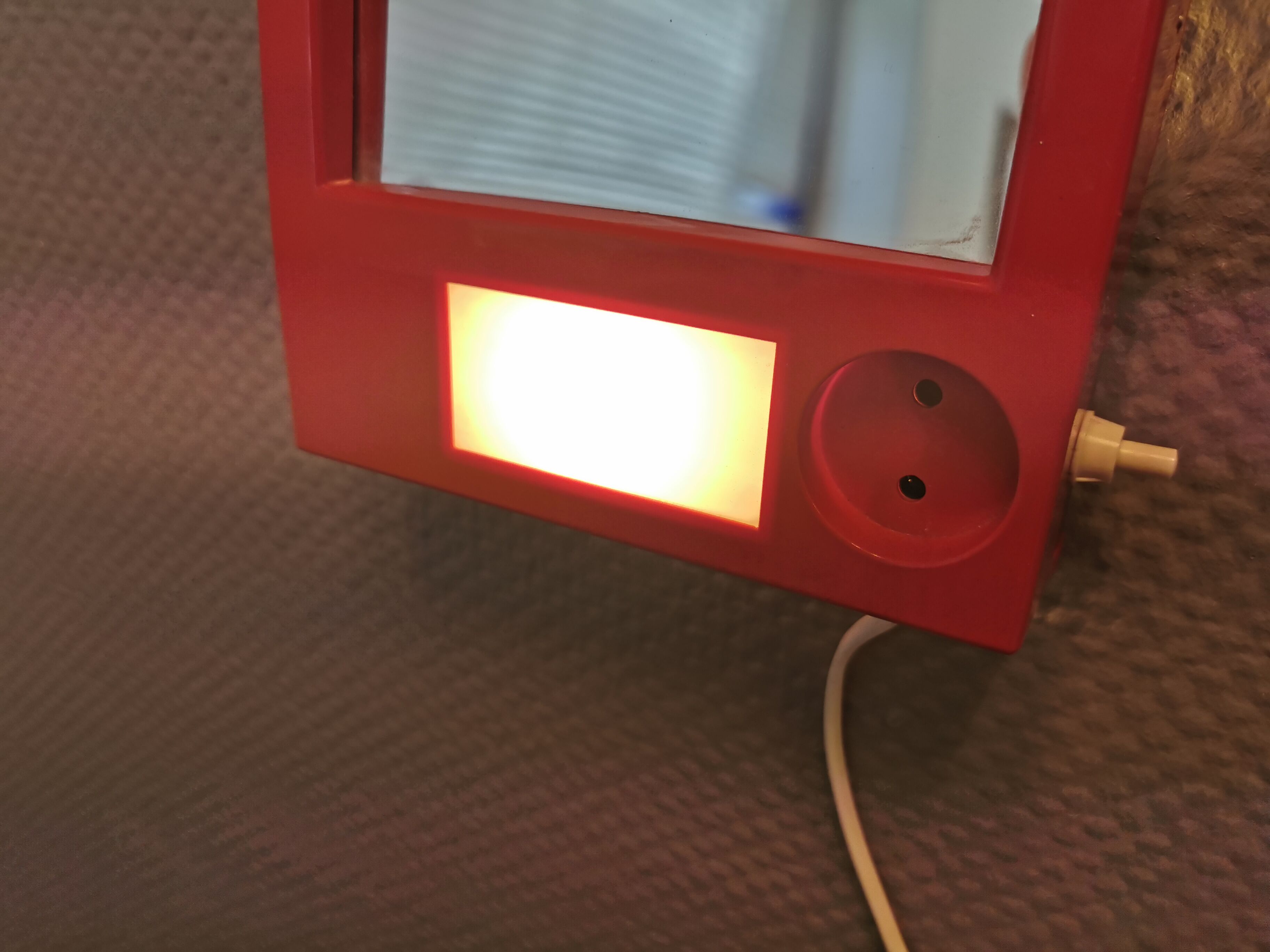Red danish make up mirror with light and power plug from the 1970