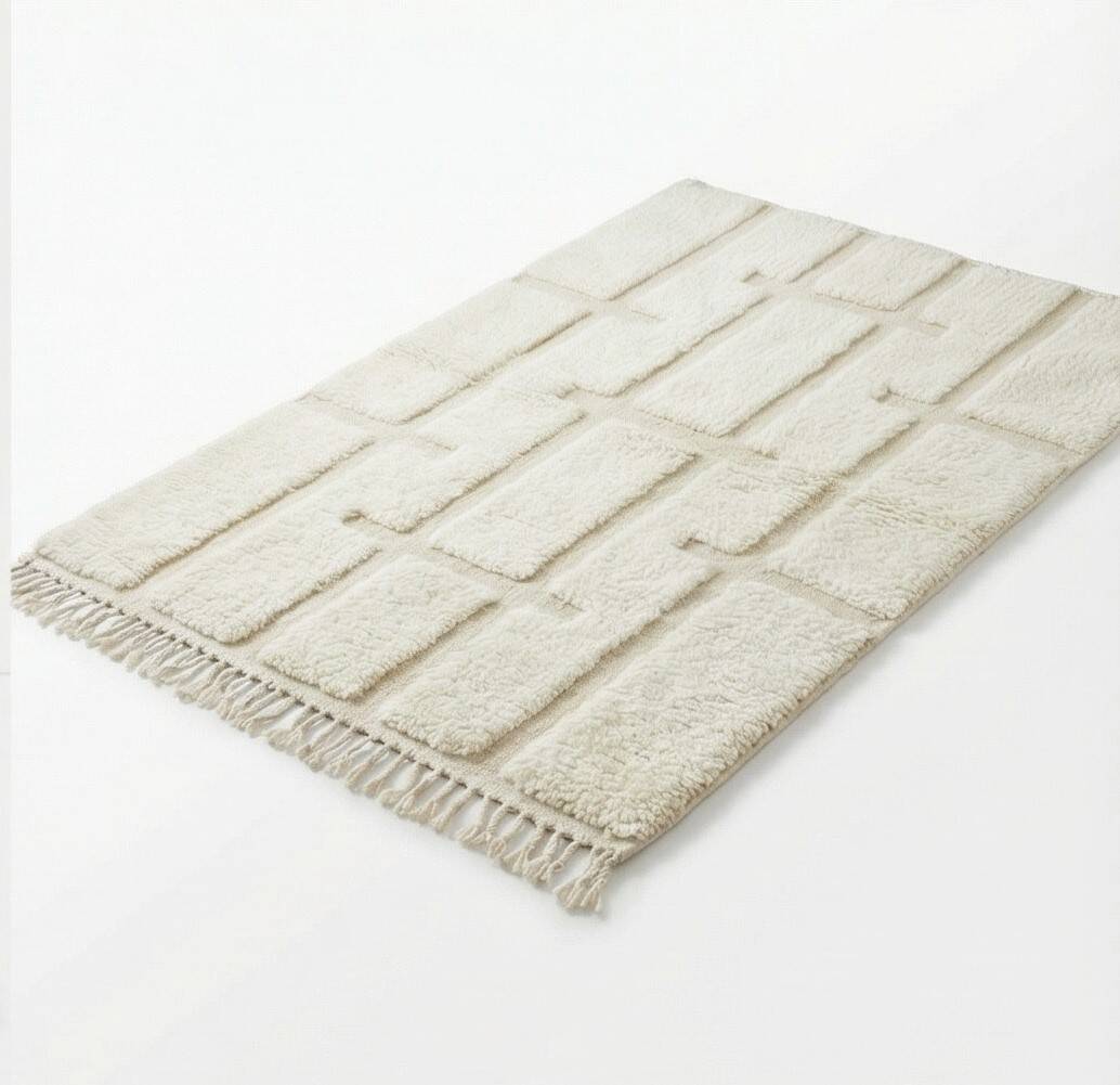 Berber rug with a white graphic pattern.
