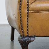 Fauteuil ancien en cuir de mouton