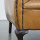 Fauteuil ancien en cuir de mouton
