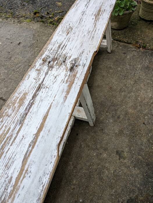 Old bench limed in white