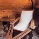Vintage armchair in solid wood and geometric weaving – lodge spirit