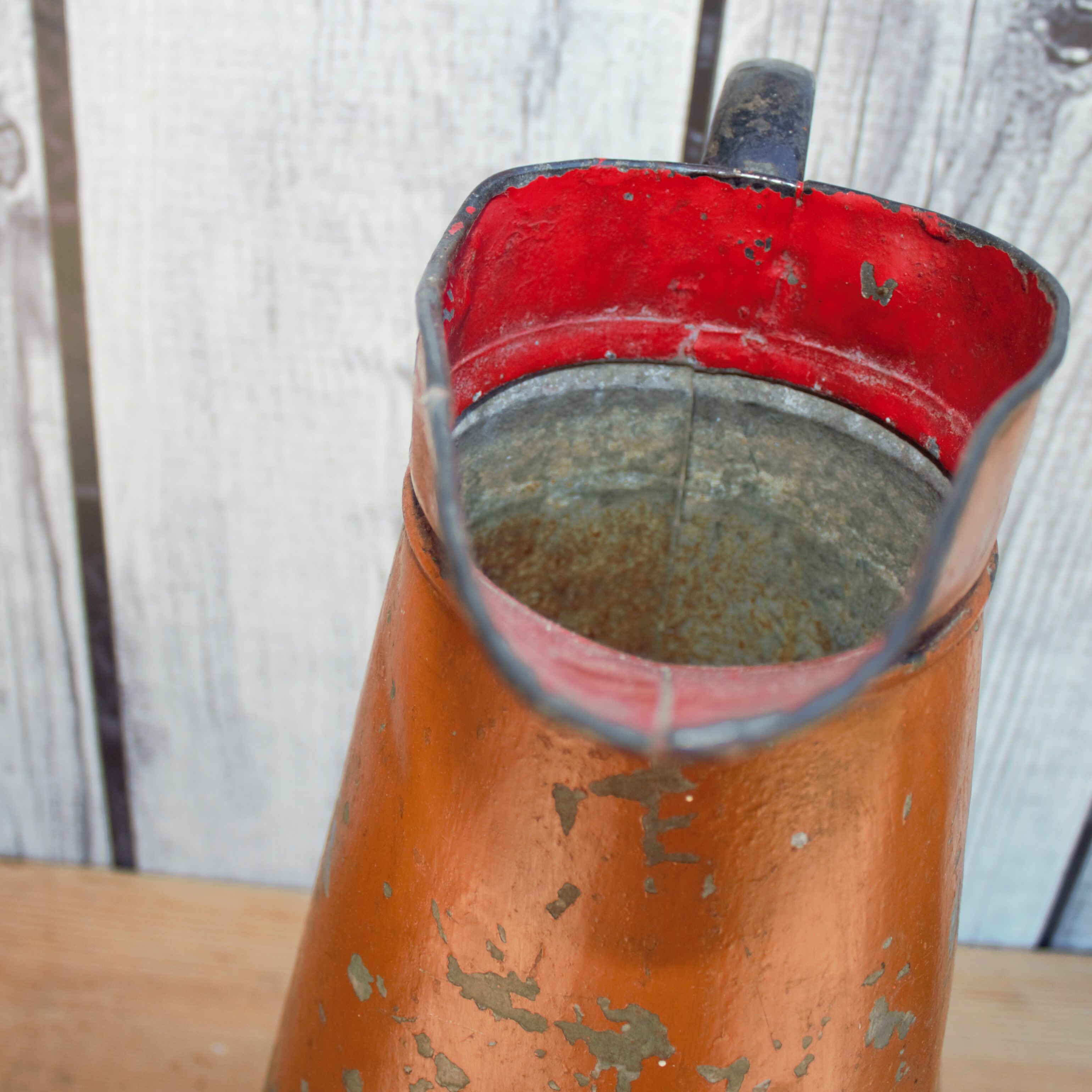 Old brown metal pitcher from France