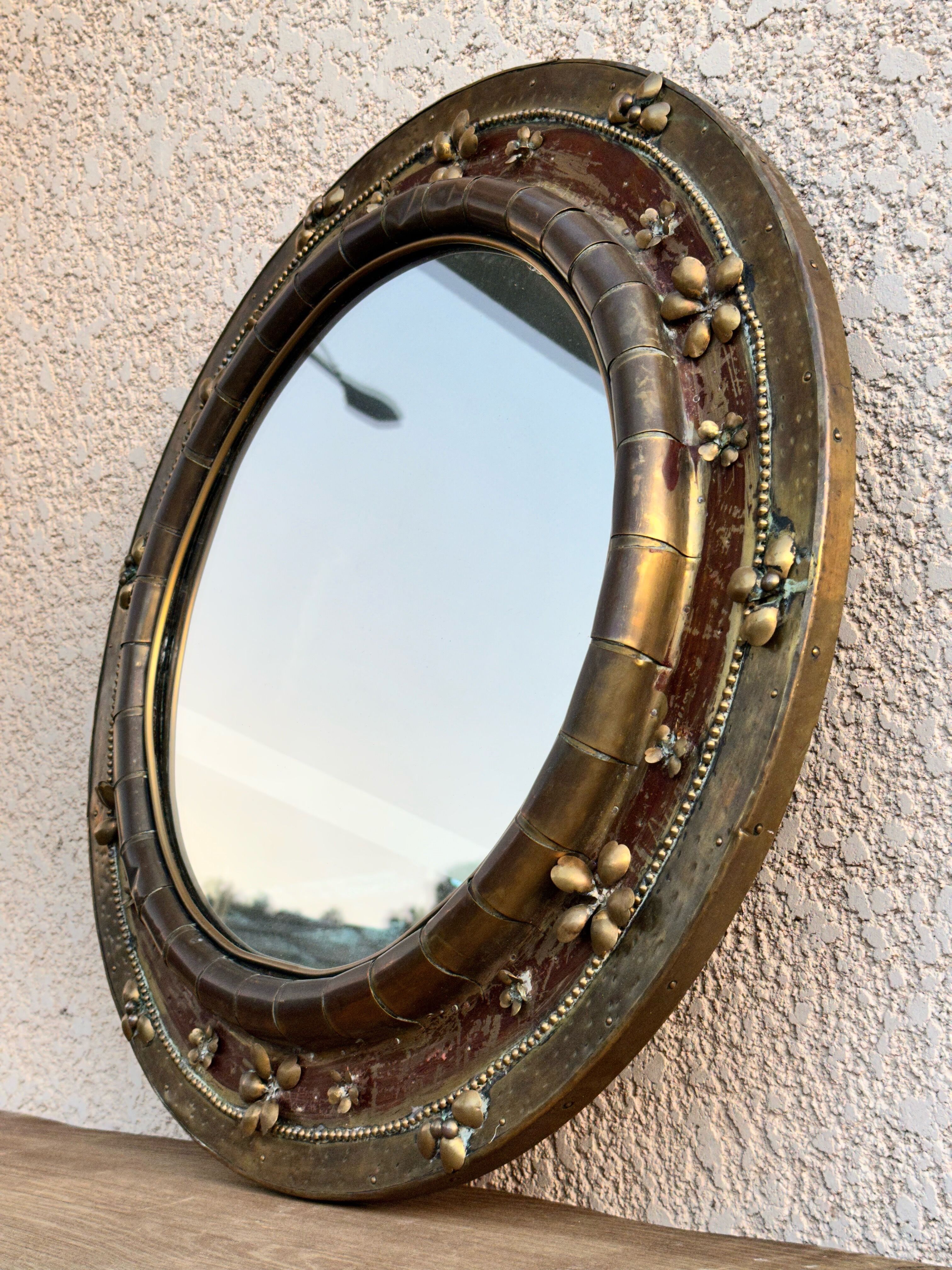 Round mirror in worked copper, Italy 1950