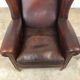 Paire de fauteuils à ailes en cuir de mouton brun foncé vintage