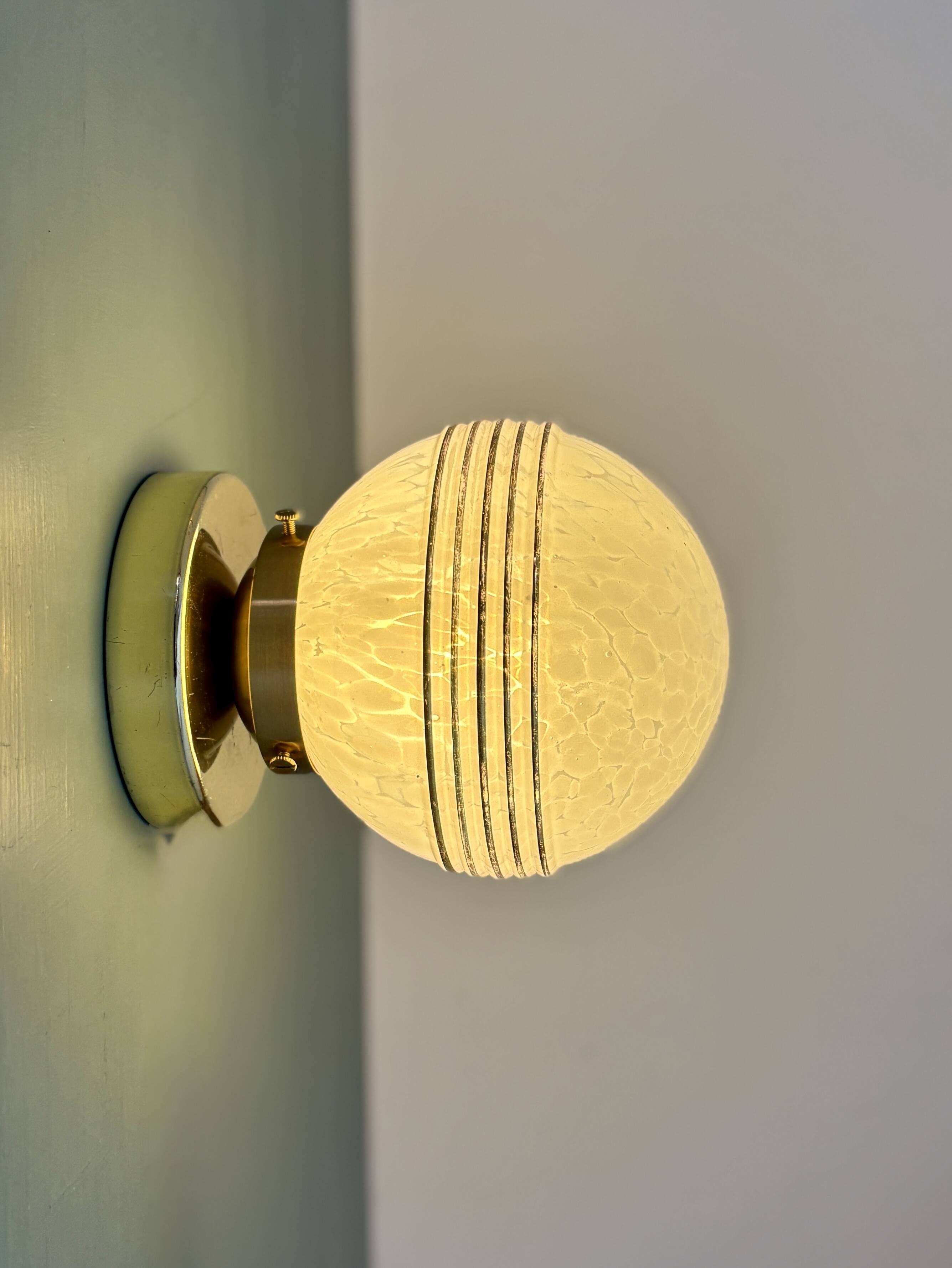 Vintage glass globe wall or ceiling light in white and gold from Clichy.