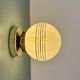 Vintage glass globe wall or ceiling light in white and gold from Clichy.