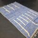 Handwoven Berber rug in blue and white, size 150x250 cm.