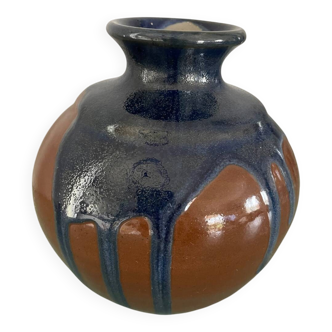 Old blue and brown vase with drips.