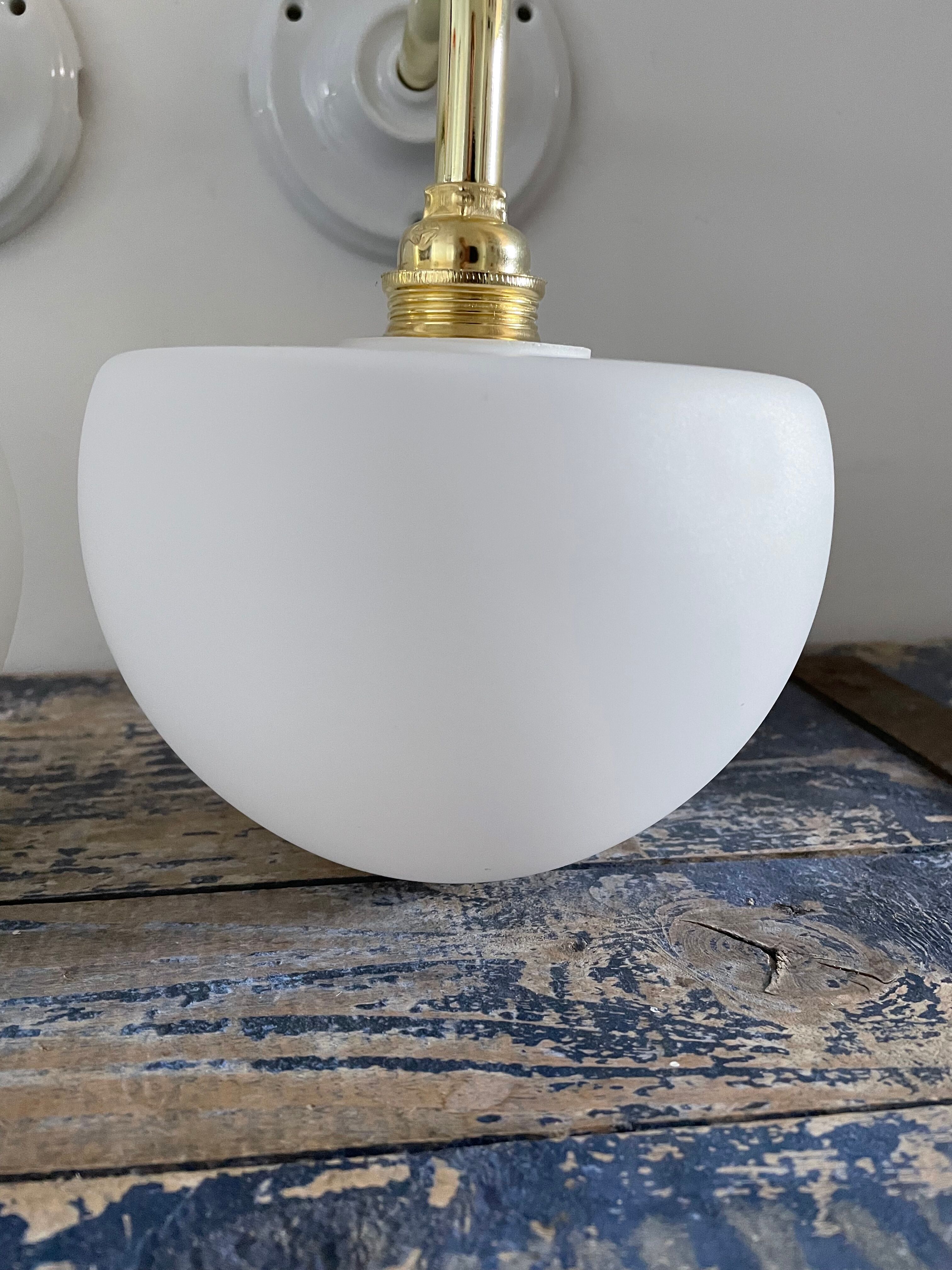 Set of two electrified white opaline wall lamps to nine