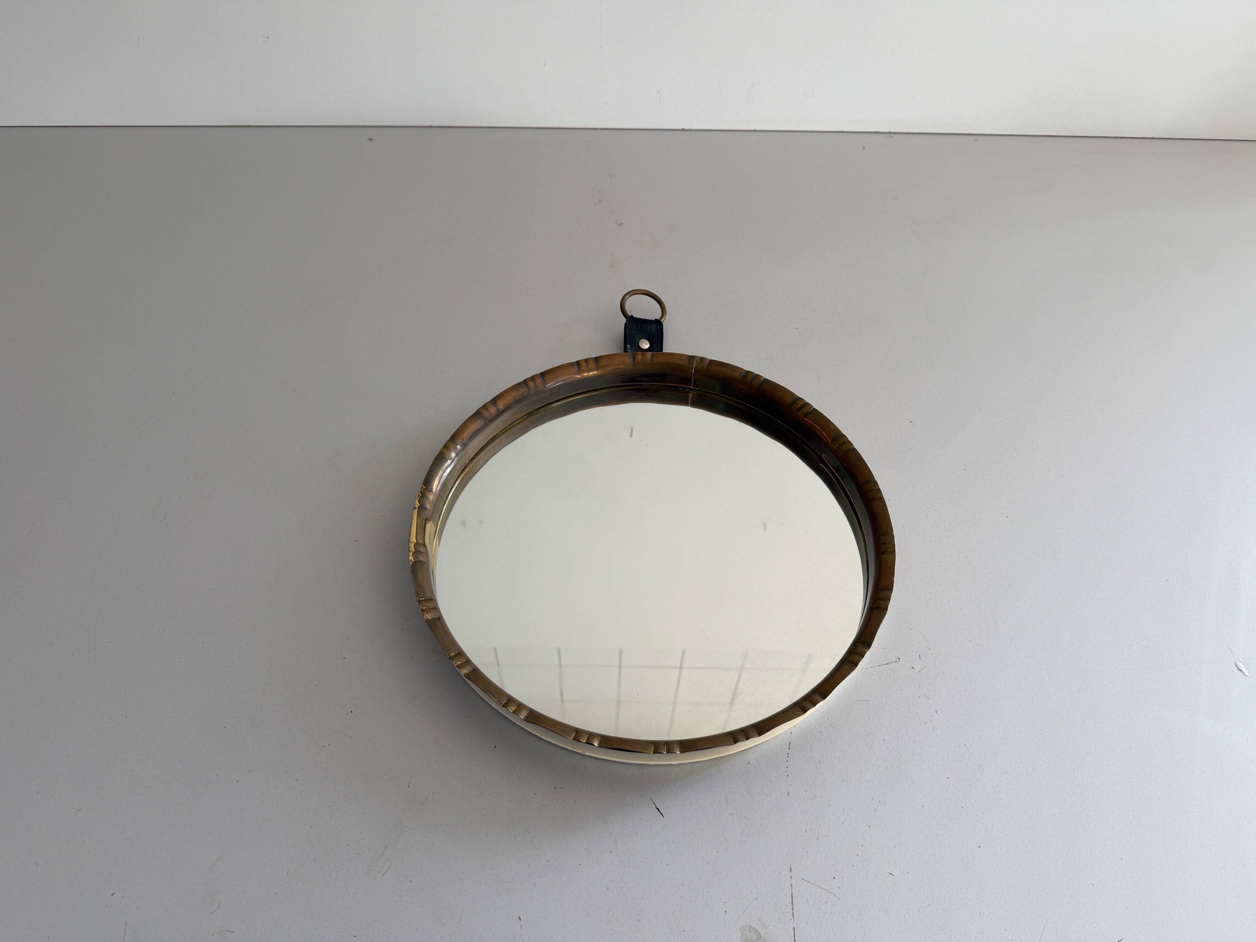 Round wall mirror with brass frame and leather hanger, 1960, Germany